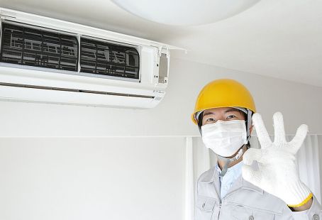 a craftsman after installing a new air conditioner