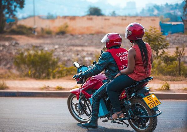 Two people on an electric motorcycle