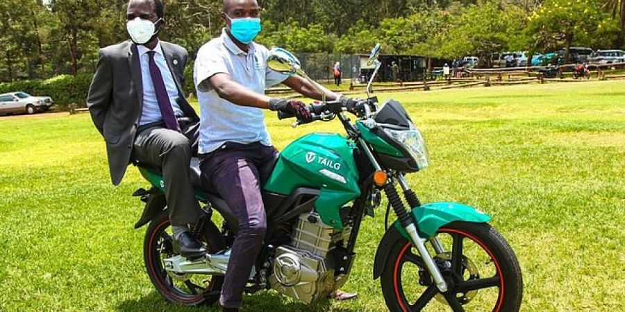 Two men on an eletric motorcycle