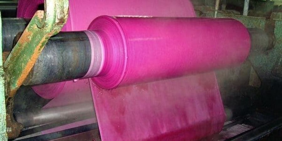 A textile machinery with pink fabric in Pakistan