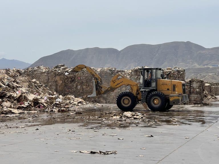 A bulldozer in a landfill site