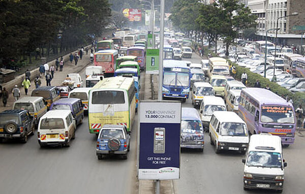 A busy street with cars and people in Nairobi