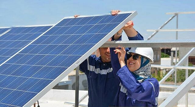 Two People Installing Solar Panels in Tunisia