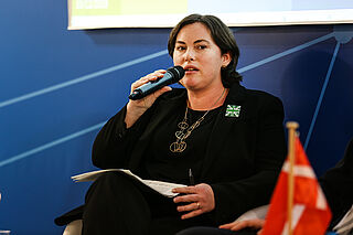 woman speaking on panel